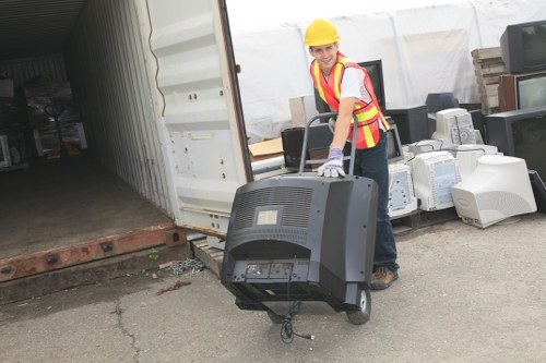 Commercial waste disposal area with various containers